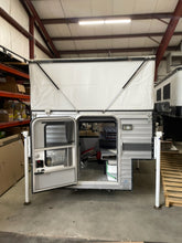 Load image into Gallery viewer, Customer Classified: Used 2021 SWIFT Four Wheel Camper Base Model Open Floor Plan with Rollover Couch