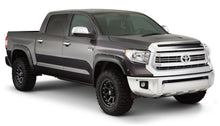 Load image into Gallery viewer, A black fender flare set installed on a Toyota Tundra truck, showing the front and rear fender flares with a smooth finish.