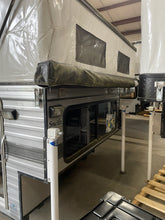 Load image into Gallery viewer, Customer Classified: Used 2021 SWIFT Four Wheel Camper Base Model Open Floor Plan with Rollover Couch
